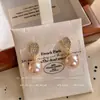 Corea del Sur Dongdaemun Lujo Accesible Diseño Personalizado Pendientes Grandes de Perlas Nicho Simples Pendientes Elegantes de Gama Alta para Mujer