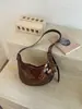 Bolsa de Croissant Transfronteriza Súper Caliente de Nicho 2026 Nueva Bolso Cruzado Versátil Casual para Viajes Diarios Bolso de Hombro Único Bolso de Axila Bolso de Empanada