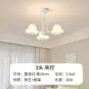 Lámpara de araña de lujo ligero estilo francés para sala de estar y dormitorio con pétalos de arte de hierro y diseño de iluminación con decoración de lazo