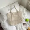 Bolsa Feminina de Couro Vazada Estilo Nicho 2026 Nova Bolsa de Praia para Férias de Verão Bolsa de Ombro Bolsa Tote Grande Capacidade para o Dia a Dia