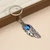 Collar Personalizado Ojo de Diablo con Pluma, Llavero de Coche de Acero Inoxidable de Nicho, Cadena Decorativa para Suéter
