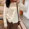 Estilo Coreano Otoño/Invierno Nueva Llegada Color Sólido Cuello Redondo Botón de Perla Cardigan de Punto Casual Simple Versátil Ropa Exterior para Mujer