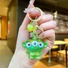 Miniso Llavero de Acrílico Colgante de Alien de Tres Ojos Llavero Lindo de Pequeño Monstruo Colgante de Mochila de Dibujos Animados Venta al por Mayor