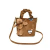 Otoño 2026 Nuevo Estilo Coreano Retro Bolso de Lona con Estampado de Leopardo Bolso para Mujer para el Trabajo Estilo Perezoso Bolso de Hombro de Color Sólido