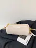 Bolso de mano con patrón tejido retro para mujer, nueva colección de otoño 2026, bolso de hombro versátil para el trabajo, bolso cruzado cilíndrico elegante y con estilo