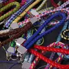 Lanyard para teléfono móvil al por mayor de fábrica, cordón para llavero de cámara de cuero PU, cuerda de muñeca para teléfono móvil de pareja, cuerda tejida de cuero