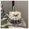 Linda Mochila de Encaje con Lunares para Mujer 2025 Nueva Moda Tendencia Bolso Cubo con Lazo Mochila Pequeña Versátil