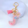 Lentejuelas Rosas de Amor Gota de Pegamento Llavero con Letra Flor de Metal Colgante de Borla Colgante para Bolso de Mujer Pequeño Fresco