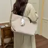 Bolso grande de mujer transfronterizo, nuevo bolso de hombro de moda otoño 2026, bolso tote texturizado casual para commuting de nicho