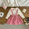 Falda plisada a cuadros para niña 2026 Nuevo Otoño Estilo Coreano Vestido con tirantes para bebé niña Atuendo de dos piezas de moda