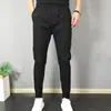 Pantalones casuales de primavera para hombre, estilo coreano, corte ajustado, skinny, marca de moda para estudiantes, pantalones cortos de celebridad de Internet, pantalones finos para jóvenes, con cordones en el tobillo