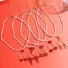 Joyería transfronteriza de San Valentín más vendida Aretes de flor de rosa roja Collar de corazón Conjunto Aretes de San Valentín europeos y americanos