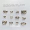 K9 japonés corazón torcido uña puntiaguda joyería taladro estéreo Súper flash blanco palo de uñas taladro DIY pequeños accesorios al por mayor