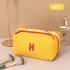 Bolsa de Maquiagem Feminina Portátil Alta Classe 2025 Nova Super Quente Portátil Grande Capacidade Cuidados com a Pele Ins Bolsa de Higiene Pessoal Bolsa de Armazenamento