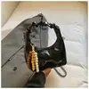 Bolso Pequeño Exquisito y de Moda 2026 Primavera/Verano Nuevo Bolso Cruzado Versátil con Cadena Mini Bolso Tipo Dumpling para Mujer