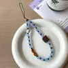 Ins Café con Leche Sal Marina Galleta Gatito Bloqueo de Color Azul y Marrón Lanyard para Teléfono Cadena de Muñeca DIY Colgante Llavero