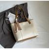 Bolso de hombro de gran capacidad para uso diario con texto, primavera de 2025, nuevo bolso de mano moderno con costuras a la moda.