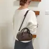 2026 Nova Moda Textura Trançada Casual Bolsa de Ombro Único Elegante para o Trabalho Transversal de Mão Estilo Coreano Simples Bolsa Mãe-Filho