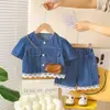 Conjunto de Dos Piezas Delgado de Mezclilla con Mangas Cortas para Niña a la Moda 2026 Verano Nuevo Estilo Atuendo de Verano Elegante para Niña con Adorno de Encaje