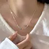 Cadena de hueso de serpiente de plata de ley S925 con colgante de semilla verde de Tara, estilo minimalista ins, collar de clavícula de alta gama para mujer