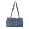 Bolso pequeño cuadrado de estilo coreano popular para mujer este año 2026 verano nuevo de color sólido texturizado de un solo hombro para el trabajo bolso de axila