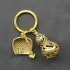 Adorno Colgante de Abundancia Auspiciosa Año Tras Año Puesto de Mercado Nocturno Adorno Pequeño Peces Dobles Dorados Calabaza Hueca de Metal Colgante para Llaves
