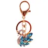 Joyas de cristal pedrería cisne blanco llavero de coche accesorios para bolso de mujer llavero colgante de metal pequeño regalo 1137