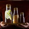 Botella de vidrio sellada sin plomo con tapa de madera de acacia, tamaño pequeño, de grado alimenticio, para té y medicina, vacía y dividida.