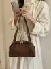 A bolsa feminina popular de grande capacidade deste ano, nova coleção de inverno 2026, bolsa tote casual vintage para ombro, moda