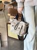 Bolsa de tela de nailon ligera estilo coreano Dongdaemun 2024 Nuevo Bolso Cubo Casual de Nicho Bolso de Hombro Versátil