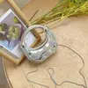 2026 Nueva Mini Bolsa de Moda Transfronteriza, Bolso de Acrílico de Media Luna, Bolso de Corazón con Doble Nudo, Bolso Cruzado de Pintalabios para Niños