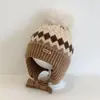 Bonitos y adorables gorros de otoño e invierno para niños, con diseño de poner, material de punto y una serie de dibujos animados, que brindan abrigo y protección para los oídos para bebés y niños pequeños.