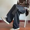 Pantalones casuales para hombre 2026 nuevo estilo moda Hong Kong modernos holgados adelgazantes a rayas rectos de pierna ancha pantalones de chándal deportivos ropa para hombre