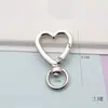 Hebilla de resorte de aleación de 25 mm para colgar rápidamente, con anillo abierto en forma de O, para bolsos de ropa de felpa, hebillas para colgar en teléfonos móviles de mujer, suministro directo de fabricantes.