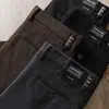 Estación europea otoño e invierno algodón modal sarga microelástico simple negocios lavado cintura media ajuste recto pantalones casuales para hombre