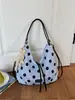 Mochila de gran capacidad con lunares transfronteriza para mujer, nuevo modelo 2026, bolso de hombro simple casual para salidas diarias y desplazamientos