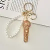 Chaveiro de Microfone 3D com Pedras Strass de Luxo Leve Transfronteiriço Microfone de Strass Super Brilhante Encanto Requintado para Bolsa com Contas de Pérola