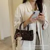 Bolsa Saco Camurça Retrô Simples da Moda 2026 Chegada Nova de Outono para Mulheres Grande Capacidade de Mão Ombro Transversal Sob o Braço