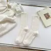 Calcetines suaves de hilo de puntos color crema para mujer, calcetines de media pantorrilla, ins, modernos, otoño e invierno, engrosados, cálidos, estilo japonés, personalizados, terciopelo australiano, largos