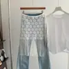 Moda Primavera y Verano Hueco Superpuesto con Cordón Delantal Falda de Malla con Borlas Dobladillo de Falda de Girasol