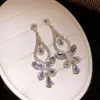 Brincos de agulha de prata transfronteiriços europeus e americanos com pingentes de borboleta e gota cravejados de diamantes, brincos da moda para o dia a dia, brincos de luxo leve e de alta qualidade para mulheres