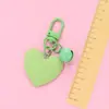 Nuevo llavero Bell love colgante lindo color resina corazón de durazno accesorios pequeño fresco adornos de corazón de durazno