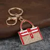 Llavero de bolso con incrustaciones de diamantes, colgante de bolso pequeño totalmente de diamantes, decoración de bolso estilo lujo ligero, llavero, venta al por mayor de regalos pequeños