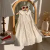 Ropa infantil estilo coreano colección verano 2026 vestido para niñas con cuello de muñeca floral francés de algodón sin mangas con encaje vestido infantil