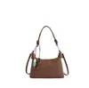 Bolso de diseño único, moderno y texturizado para mujer, nuevo bolso versátil de verano 2026, bolso tipo dumpling para hombro y cruzado estilo ins