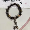 Fabricantes suministro pulsera de cachorros de cerámica diseño de nicho pulsera nuevo chino lindo cachorros huesos cuentas juguetonas