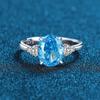 Anillo de mujer con diamante de alto carbono en forma de huevo y diamante Padma rojo, rosa, azul marino y blanco en plata de ley 925 con corte de flor de hielo.