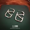 Moda europea y americana metal aretes de lujo ligero transfronterizos más vendidos aretes de temperamento simple aretes de personalidad de nicho venta al por mayor