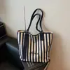 Bolsa de Lona Rayada de Venta Caliente Transfronteriza Nueva para Mujer Bolso Tote de Clase de Gran Capacidad Bolso Tote de Hombro Estilo Coreano para Viajes al Trabajo