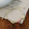 Jingdezhen Navidad Pulsera de Cuerda Trenzada de Cerámica Pulsera de Trébol de Cuatro Hojas Joyería Artística Hecha a Mano Venta al por Mayor Pulseras de Cerámica para Atracciones Turísticas